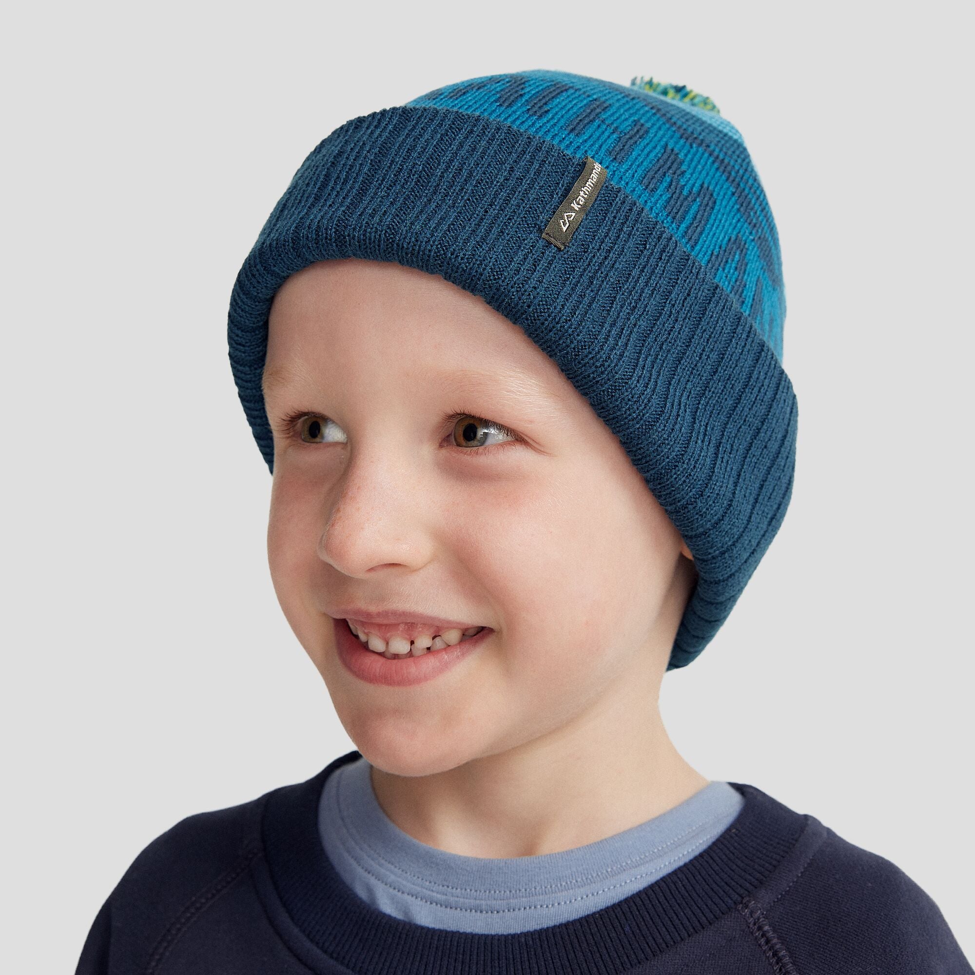 MTN Skies Kids Pompom Beanie - Dark Eddy – Kathmandu AU